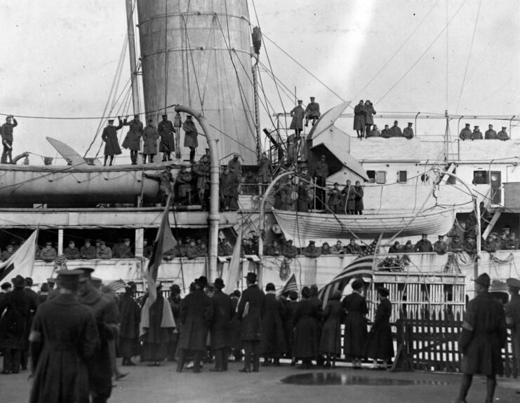 Members of the 369th Infantry Regiment aboard a ship at port