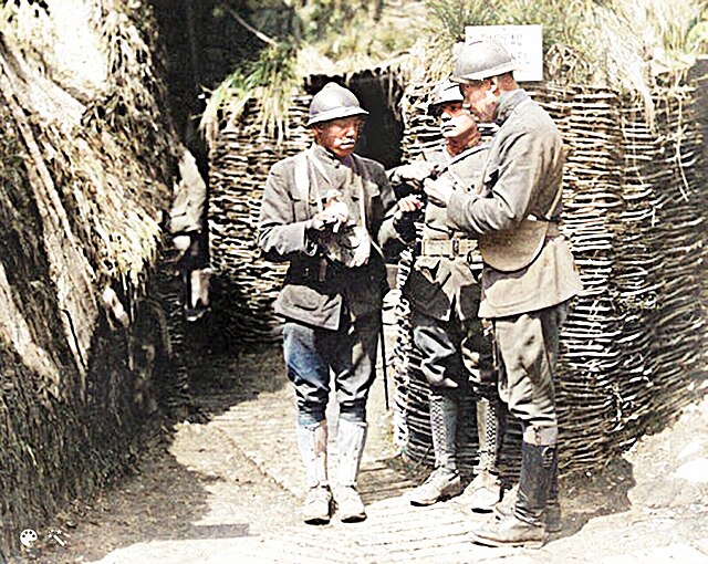 Three Harlem Hellfighters standing in a trench