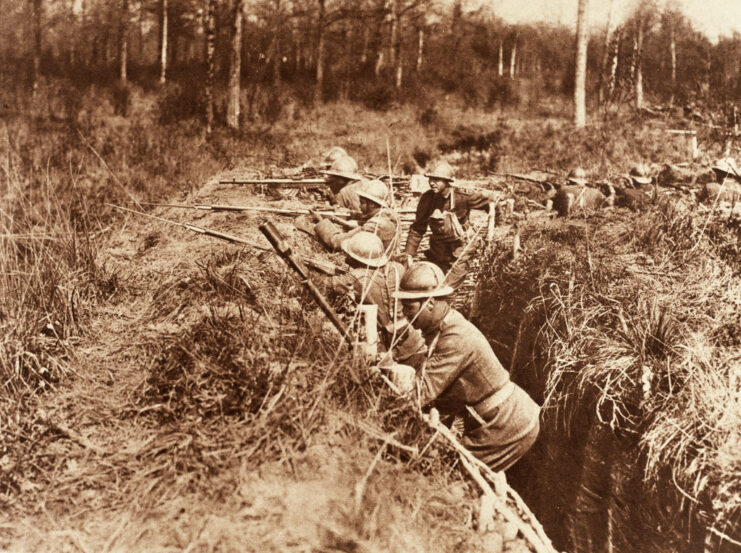 Members of the 369th Infantry Regiment standing in a trench