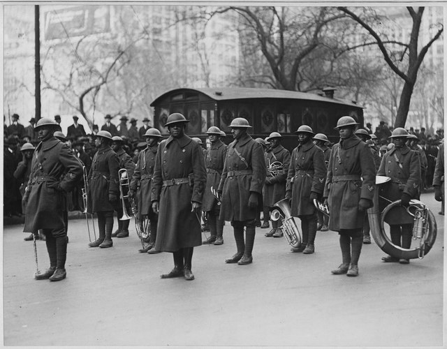 369th Infantry Regimental Band standing in a street