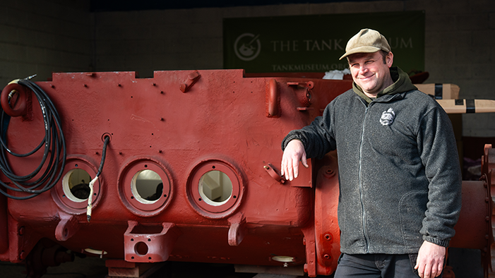 Matthew Pyle standing next to an M47 Patton
