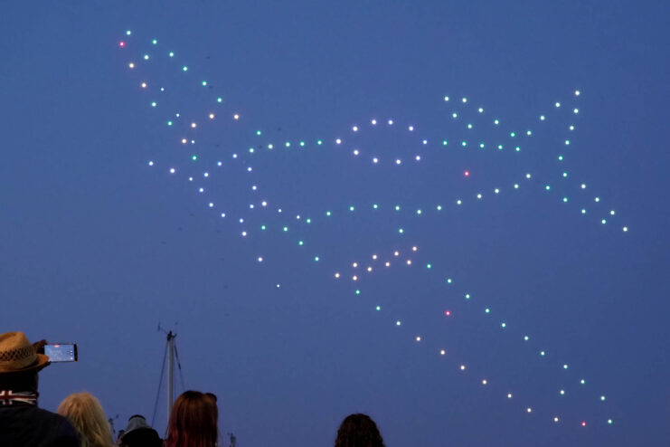 Drones in the shape of a Supermarine Spitfire in the night sky