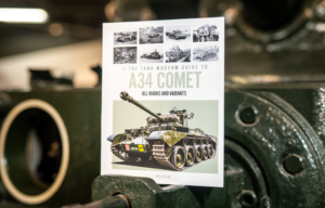 "The Tank Museum Guide to the A34 Comet" atop an armored vehicle