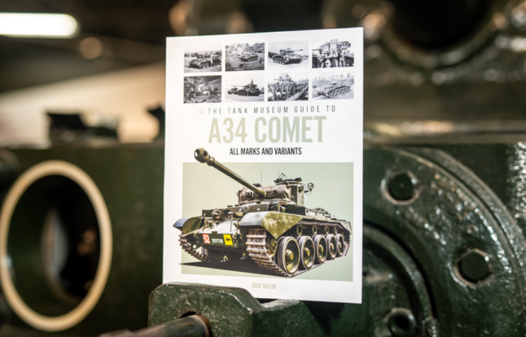 "The Tank Museum Guide to the A34 Comet" atop an armored vehicle