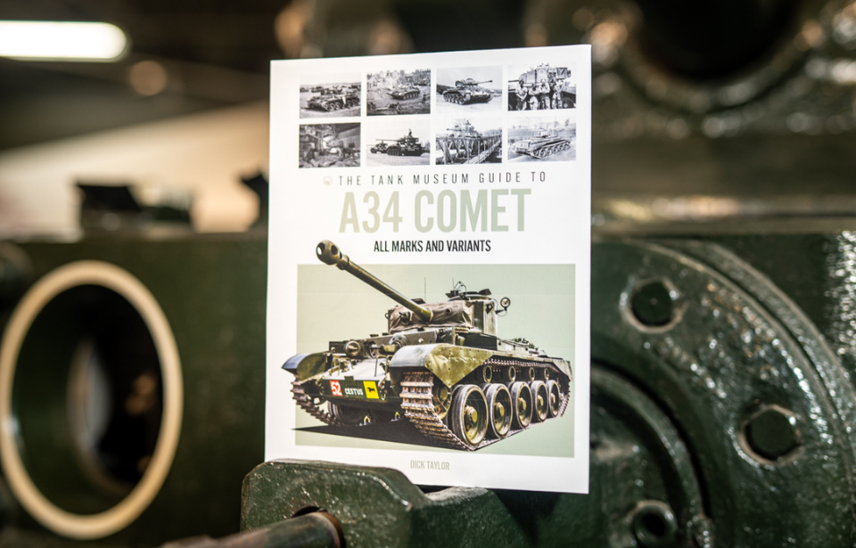 "The Tank Museum Guide to the A34 Comet" atop an armored vehicle