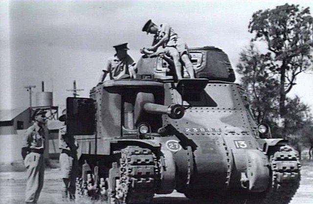 Soldiers sitting atop an M3 Grant