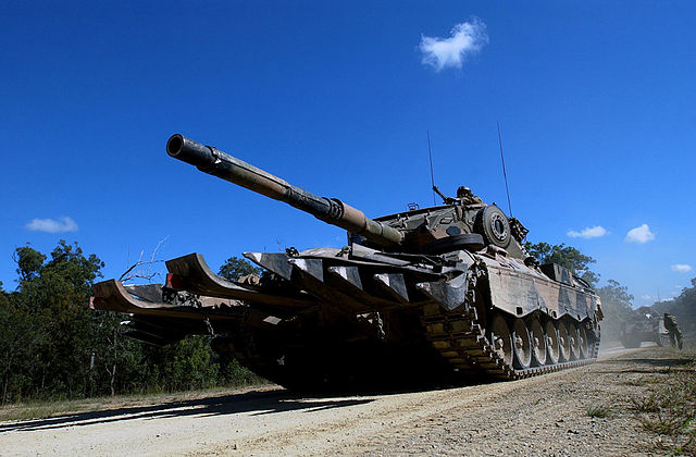 Leopard AS1 driving along a dirt road