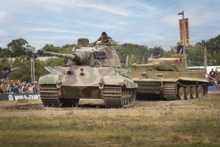 A King Tiger and Tiger 131 driving along a dirt track