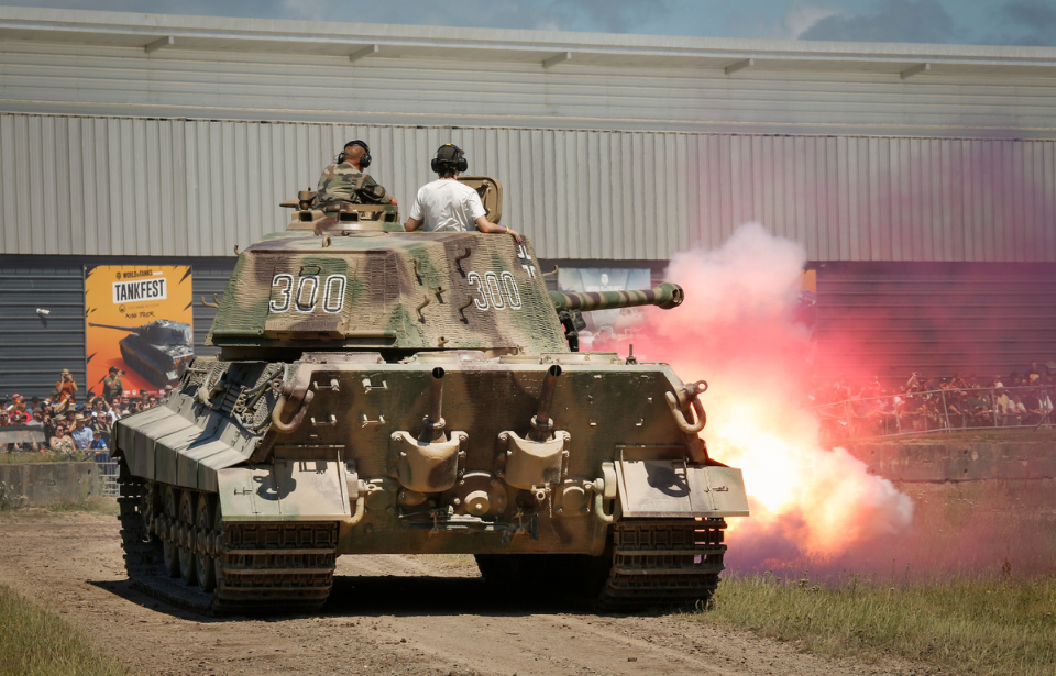 A King Tiger firing its gun