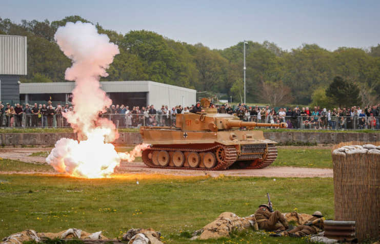 Tiger 131 and actors dressed as World War II-era soldiers participating in a re-enactment