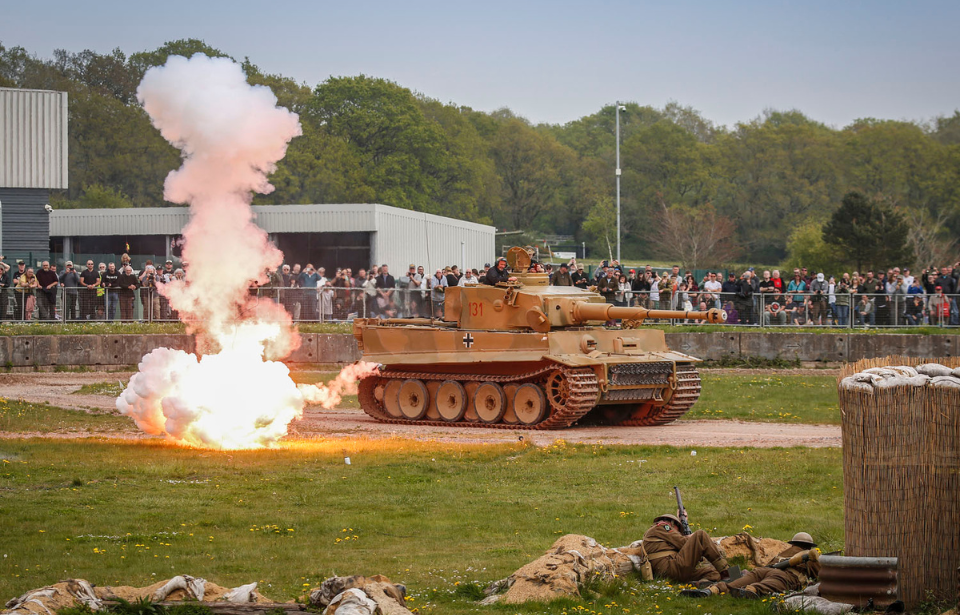 Tiger 131 and actors dressed as World War II-era soldiers participating in a re-enactment