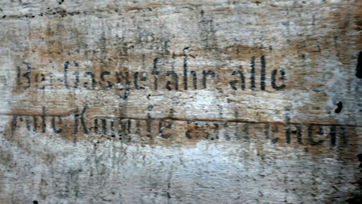 Close-up of a sign written in German