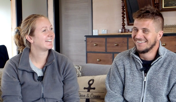 Carrie and Shaun Tullier sitting in their living room