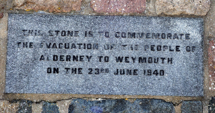 Sign marking the removal of Alderney's residents to Weymouth during World War II