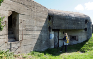 Woman standing outside a World War II structure