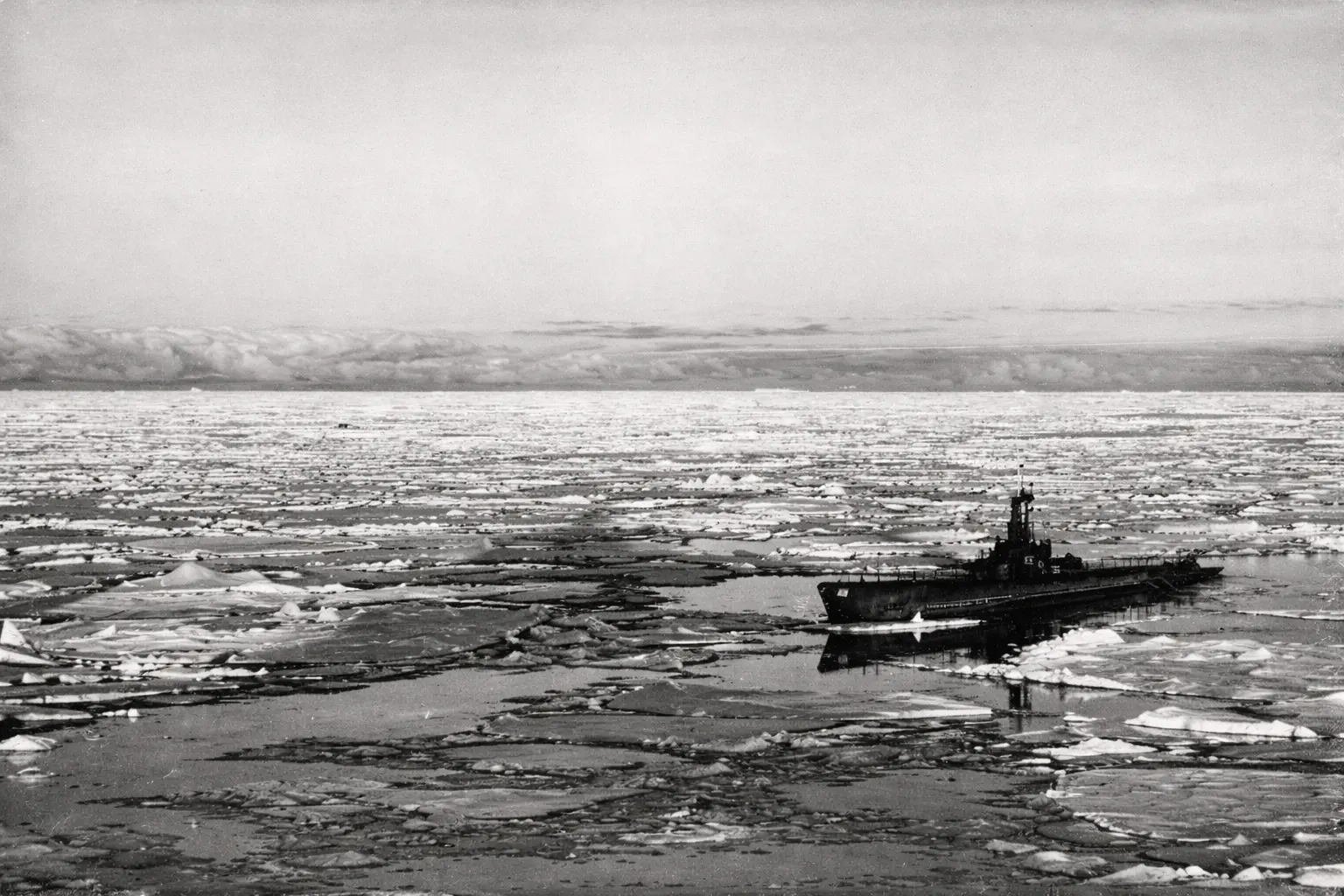An image of a US Navy battle ship making its way to the Antarctic during Operation Highjump.