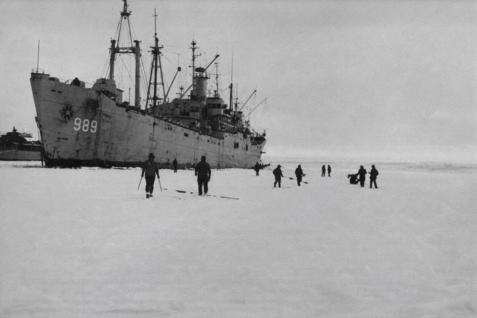 An image taken during operation High Jump where a few US Navy Marines are investigating a site in the Antarctic.