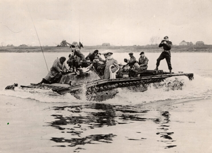 Winston Churchill crossing the Rhine in a vessel with other men