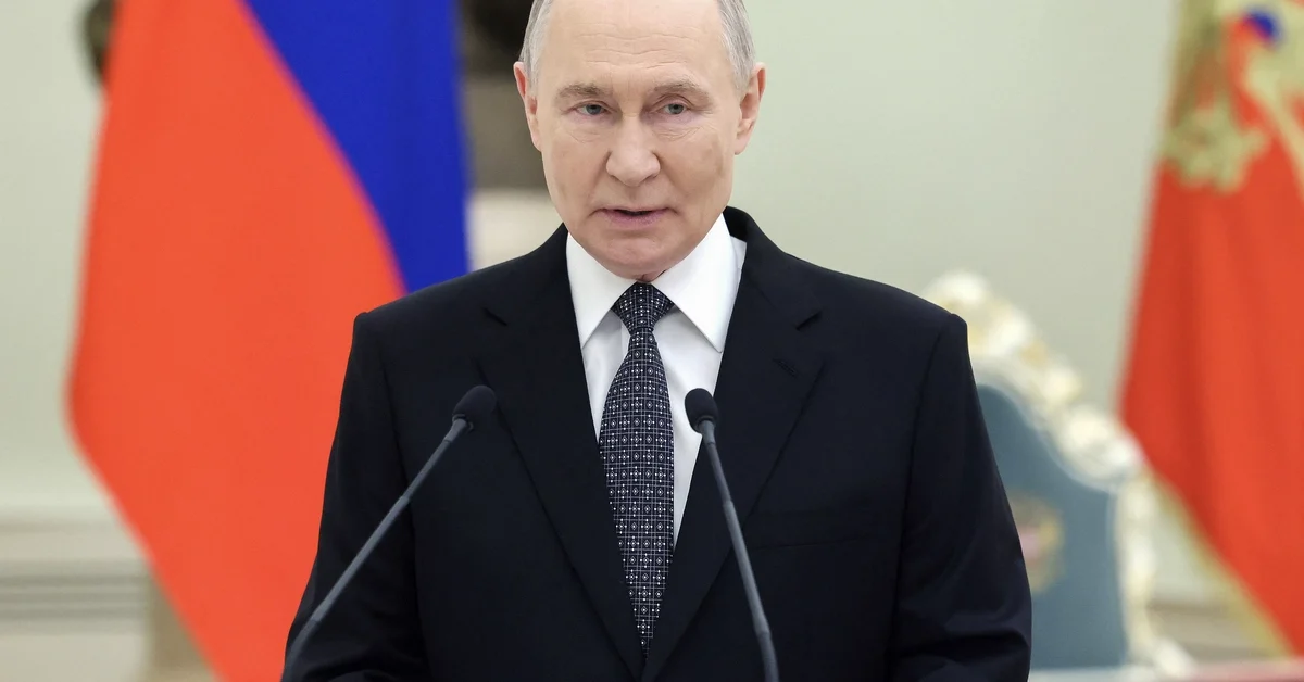 In this pool photograph distributed by the Russian state agency Sputnik, Russia's President Vladimir Putin delivers a speech at a ceremony to award servicemen with Gold Star medals of 'Hero of Russia' on Defender of the Fatherland Day in Moscow on February 23, 2026. 