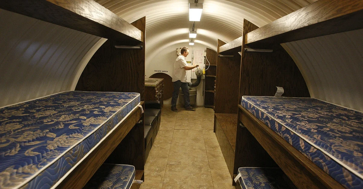 Ron Hubbard, President and CEO of Atlas Survival Bunkers, demonstrates how to manually pump air (if electricity ever stopped working) into a 25' corrugated pipe bomb shelter (with 5 beds) which Hubbard's company assembles at his small plant in Montebello on January 10, 2013. This shelter has been upgraded with oak interior finish.