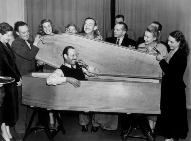 Escapologist and conjuror Jasper Maskelyne after escaping from a coffin at the Kingscourt Hotel, Bayswater, in twenty seconds. He was challenged by Captain A. G. Forbes, the manager of the hotel, to duplicate his famous coffin escape which he then proceeded to do, winning a bet for five pounds into the bargain.