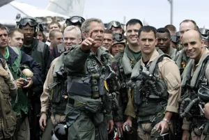 US President George W. Bush meets pilots and crew members of the aircraft carrier USS Abrahan Lincoln as they return to the US after being deployed in the Gulf region 01 May 2003