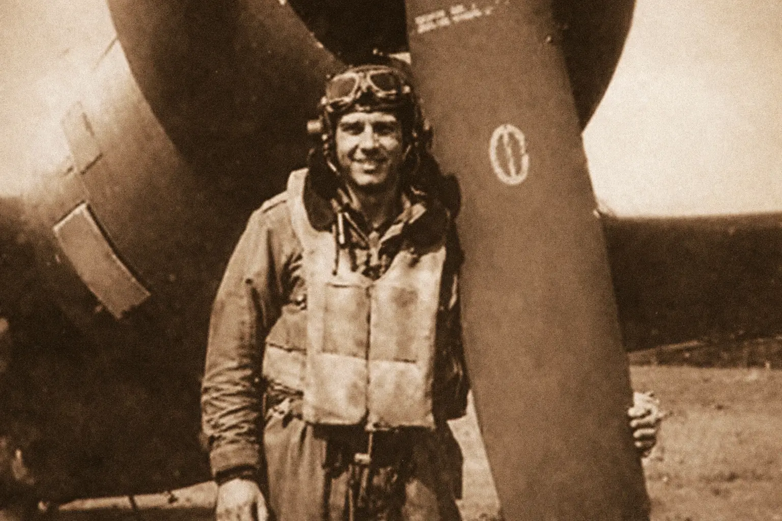 Pilot Jack Tueller standing infront of his P-47 plane.