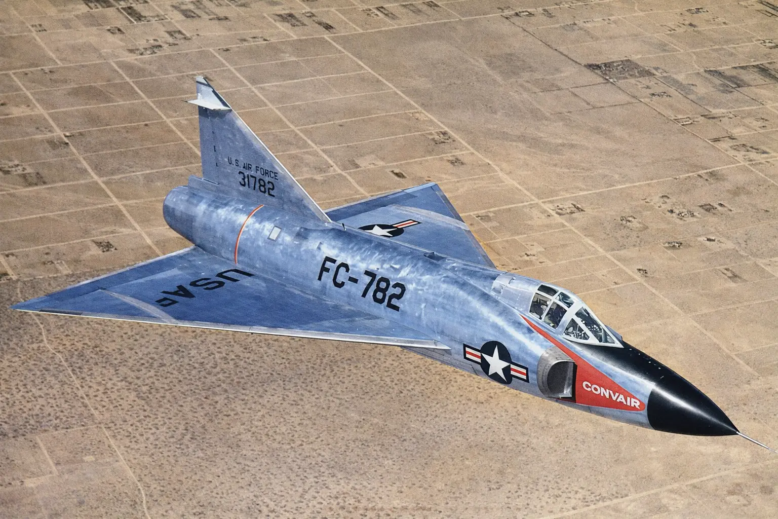 Convair F-102 Delta Dagger flying in the sky.