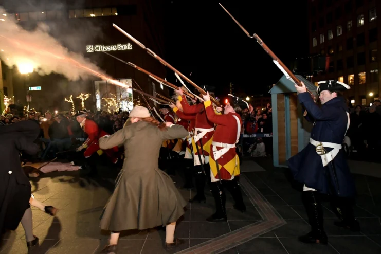 Actors portraying British soldiers and American Colonists at the reenactment of the 250th Anniversary of the March 5, 1770 Boston Massacre at the Old State House on March 7, 2020 in Boston, Massachusetts.