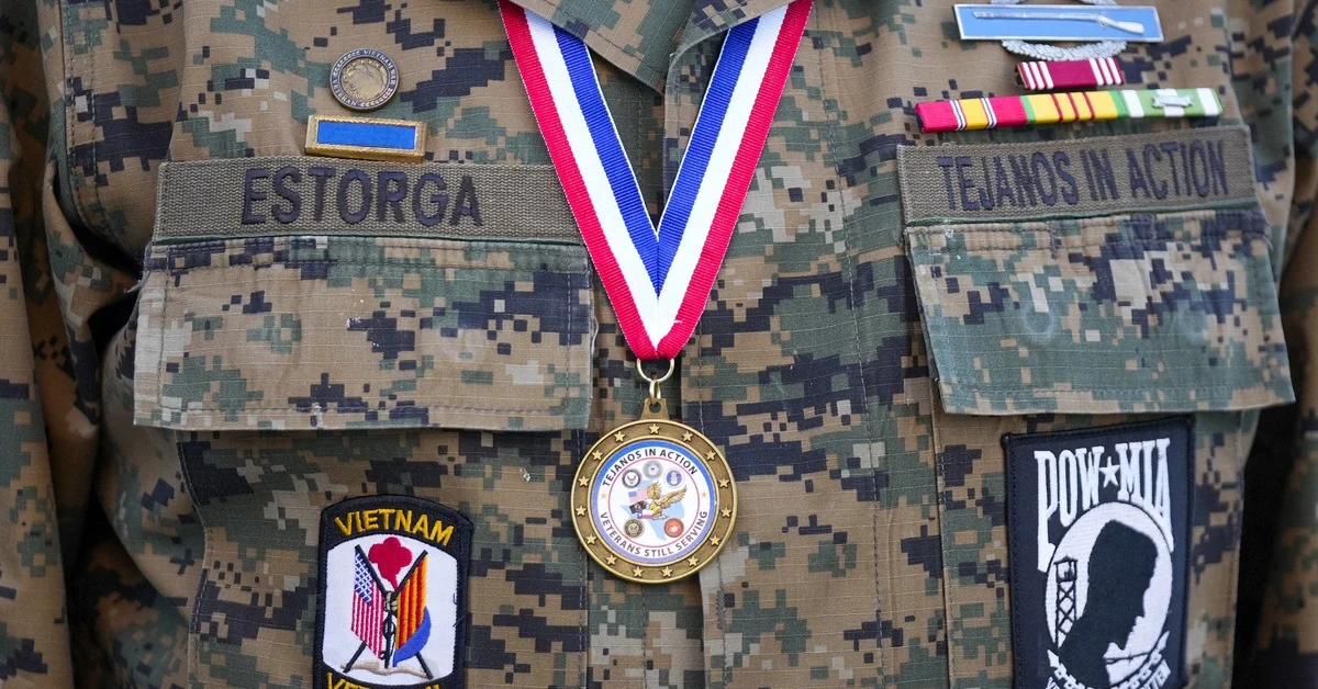 AUSTIN, TEXAS - NOVEMBER 11: Marshall Estorga, an Army veteran of the Vietnam War, prepares to march in the Veterans Day Parade in downtown Austin on Tuesday, Nov. 11, 2025. Hundreds lined Congress Avenue to honor military service members.