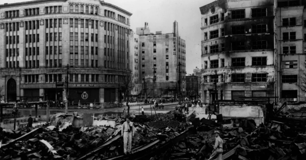 9th June 1945: US soldiers examine the results of a B29 Superfortress bomb run on the streets of the Ginza district, Tokyo. Bombings by American B 29 super fortresses destroyed many buildings in the campaign to wipe out Japanese war industries.