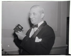William Knudsen, co-director of the Office of Production Management, receives the Vermilye Medal for "outstanding contribution in the field of industrial management" from Philip Staples, President of the Franklin Institute, which made the award, Dec.1, 1941, at a dinner in Philadelphia's Franklin Hall.