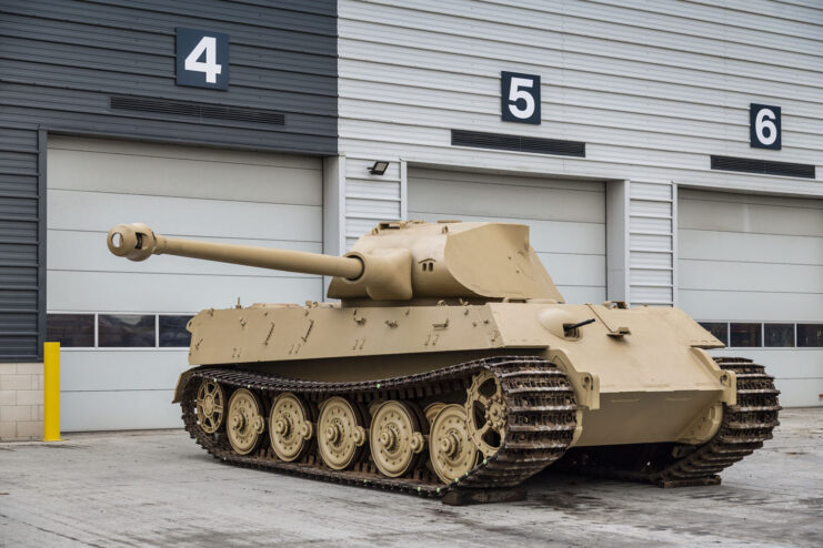 King Tiger V2 parked outside a workshop