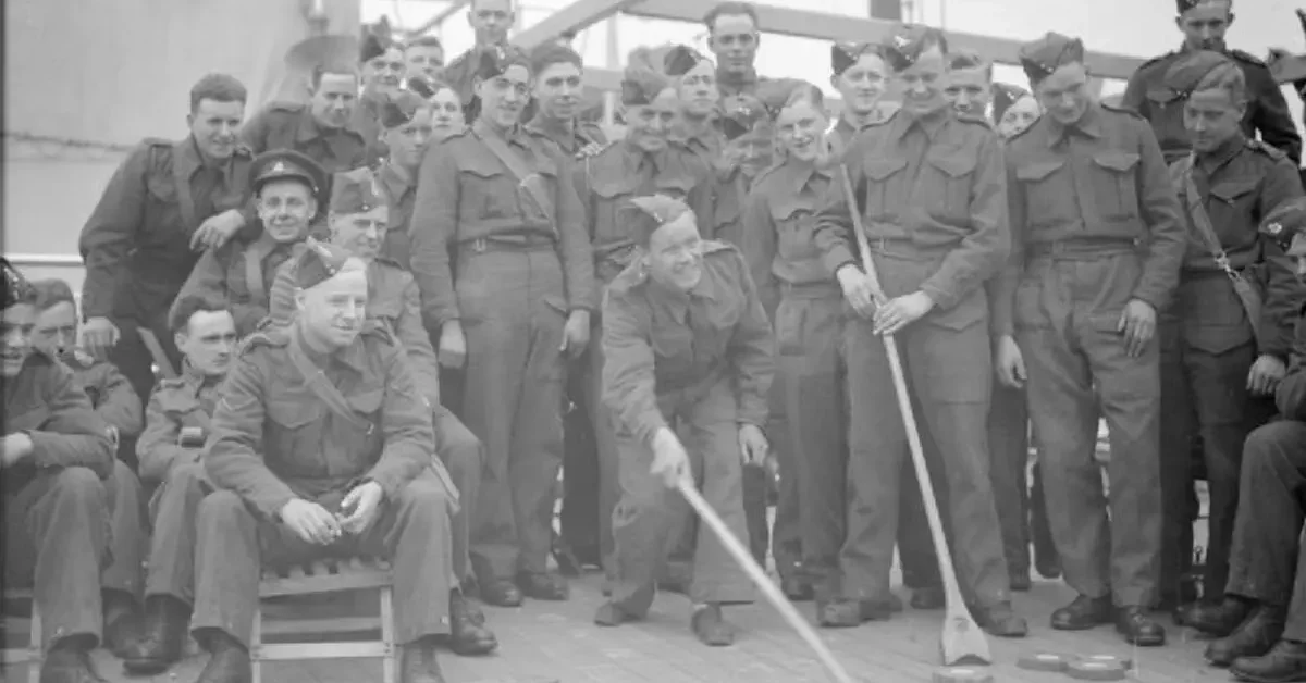 The Narvik Campaign, 1940Troops of the 1/6th Battalion, Duke of Wellington's Regiment (West Riding), 147 Brigade, 61st Division enjoy a game of deck shuffleboard on board the Polish Navy liner MS Sobieski. She is lying off Gourock at the mouth of the River Clyde and has been used as a troopship for some months. The men will soon be heading off to Norway.