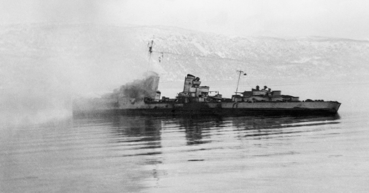 The Second British Naval Action Off Narvik. 13 April 1940.An enemy destroyer abandoned and on fire east of the harbour. She drifted until the next morning (14 April) when she sank.