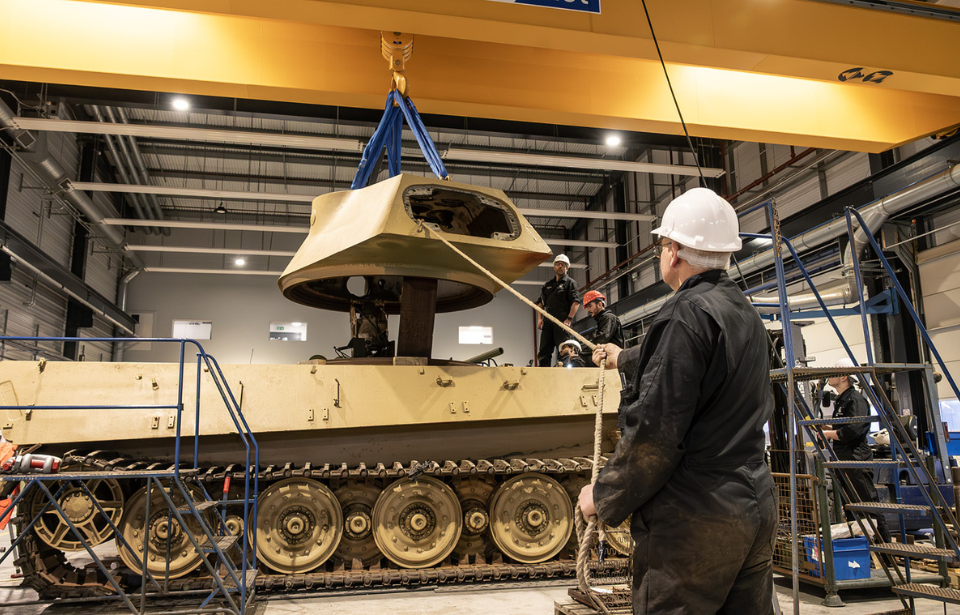 Worker overseeing work on the King Tiger V2