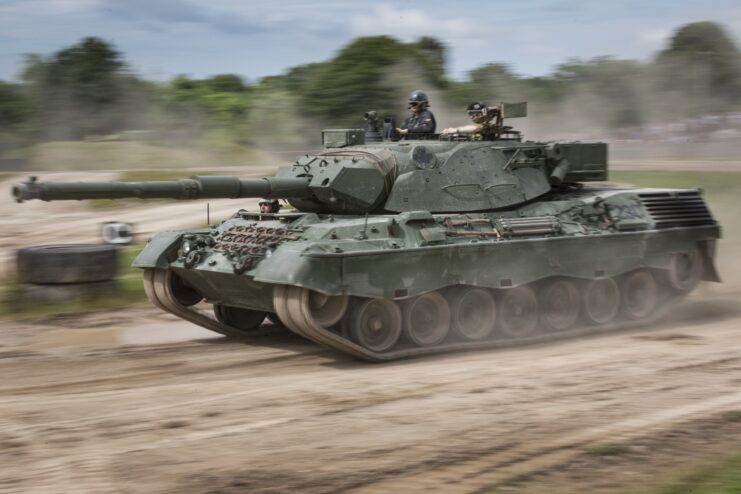 Leopard 1 driving along a dirt road
